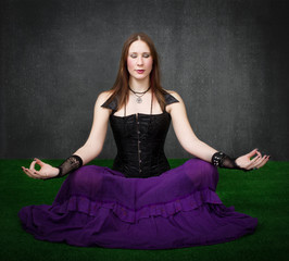 gothic woman meditation in zen pose