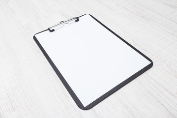 A piece of blank paper on clipboard