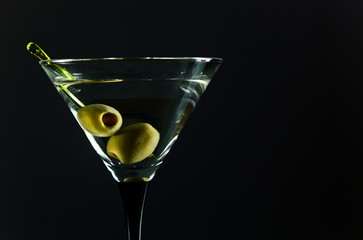 martini with green olives