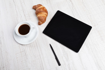 Blank tablet pc and coffee on desk