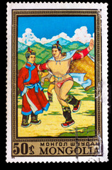 CIRCA 1972: A stamp printed by MONGOLIA , Two men dan