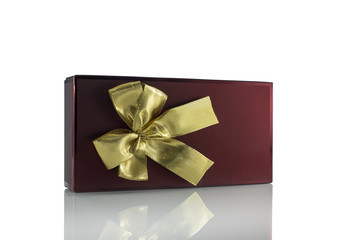 golden bow on red present