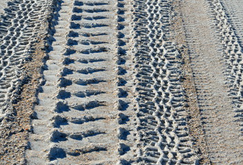 Tire Tracks on the Beach Sand