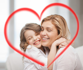 smiling mother and daughter hugging