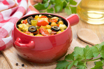 chicken stew with chickpeas and vegetables in the pot