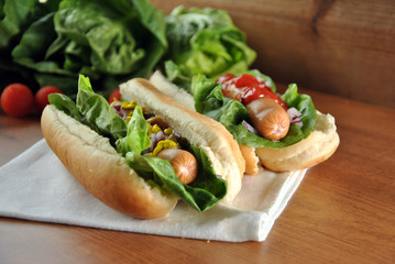 two hot dogs with salad