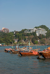 small boats moored in ocean water