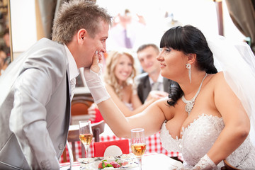 Young newly married couple quarreling at restaurant