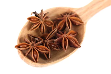 Tragetasche Star anise in wooden spoon, isolated on white © Africa Studio