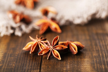 Star anise on wooden background
