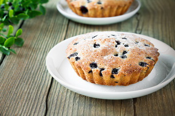 Homemade mini fresh blueberry pies on white plate