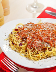 Pasta with sauce and parmesan cheese
