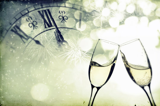 Glasses with champagne over holiday background