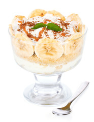 Delicious dessert with banana and caramel isolated on white