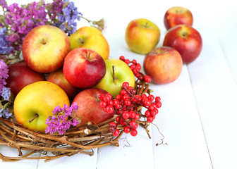 Juicy apples on white wooden table