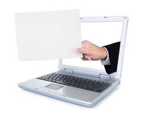 Hand carrying blank paper out of a laptop screen