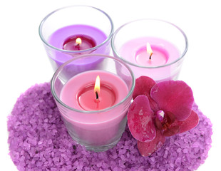 Obraz na płótnie Canvas Beautiful colorful candles, orchid flower, sea salt isolated