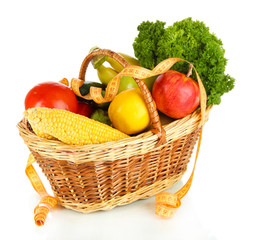 Fresh vegetables in wicker basket isolated on white