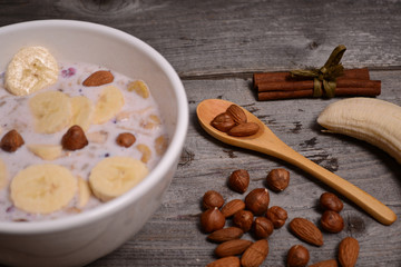 bowl of muesli and millk with fresh banana close up