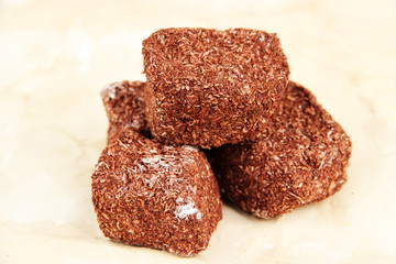 Tasty oriental sweets (Turkish delight), on brown background