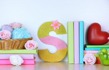 Shelf decorated with handmade knit letter
