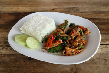 Fried pork with sweet basi and white jasmine sticky rice