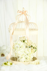 Beautiful decorative cage with beautiful flowers