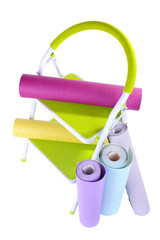 Small ladder and wallpaper rolls, isolated on white