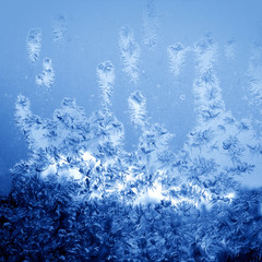 Frosty winter pattern at a window glass