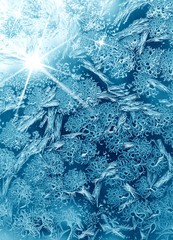 Frosty winter pattern at a window glass