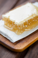 Close-up of a golden honeycomb, vertical shot