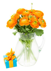 bunch of orange ranunculus flowers  in vase