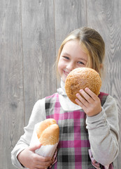 smiling girl offers bun