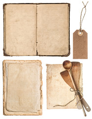 Vintage wooden kitchen utensils, old cookbook, pages
