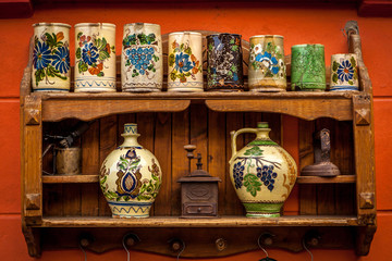 Various ceramic traditional pottery lined up for sale.