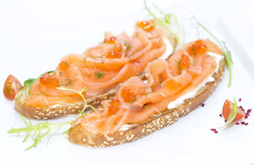 sandwiches with salmon caviar and greens adorned