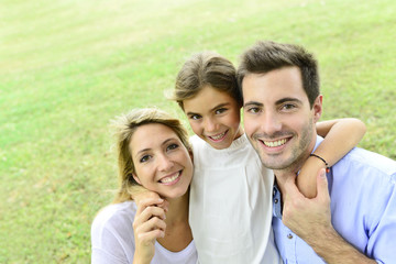 Portrait of happy family standing in park