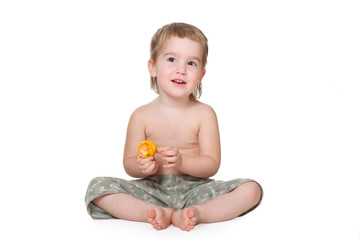 child with mandarin isolated on white background