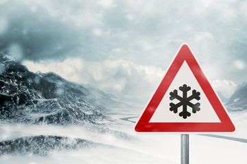 winter driving - snowfall - warning sign