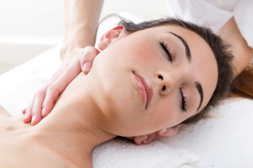 Fototapeta na wymiar Woman enjoying shoulder massage at beauty spa