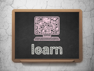 Education concept: Computer Pc and Learn on chalkboard