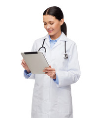 female doctor with stethoscope and tablet pc