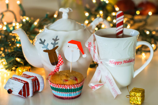 Christmas muffins with holiday mug and teapot