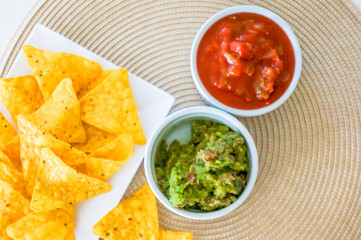 Mexican nachos. Homemade mexican salsas with corn chips