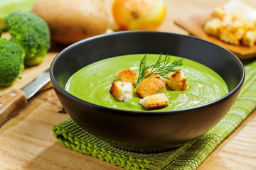 Broccoli cream soup and ingredients on table