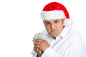 Greedy miserly christmas man possessive of his cash - obrazy, fototapety, plakaty