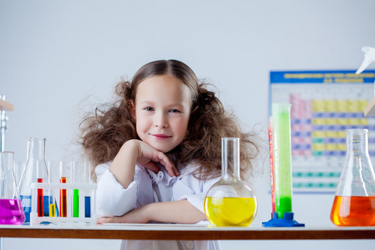 Portrait of smiling adorable girl posing in lab