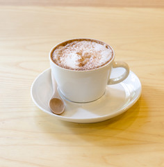 A Coffee on the wooden desk
