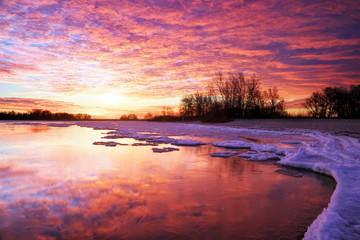 Winter landscape with lake and sunset fiery sky. - Powered by Adobe