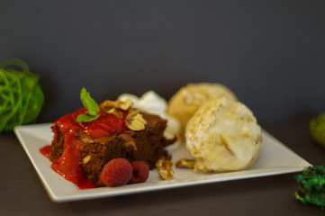 Brownies with ice-cream and raspberries